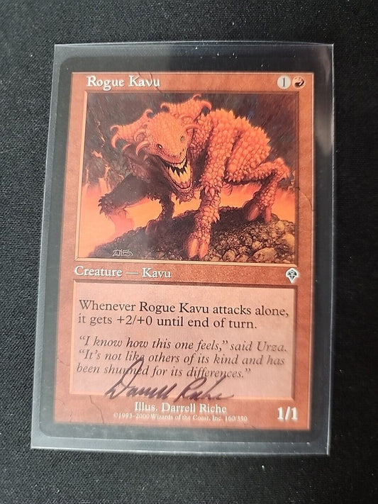 An image of a "Rogue Kavu SIGNED" creature card from the Magic: The Gathering game by Wizards of the Coast, featuring an illustration of a fierce orange Kavu on a rocky terrain. The card includes text with game statistics and abilities.