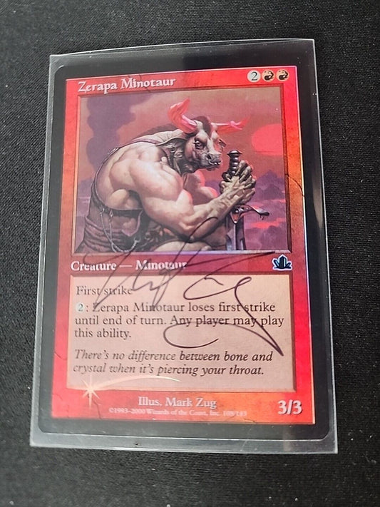 An image of the "Zerapa Minotaur FOIL SIGNED" card from the Magic: The Gathering game, featuring artwork of a muscular minotaur with a red background and game stats displayed on the card.